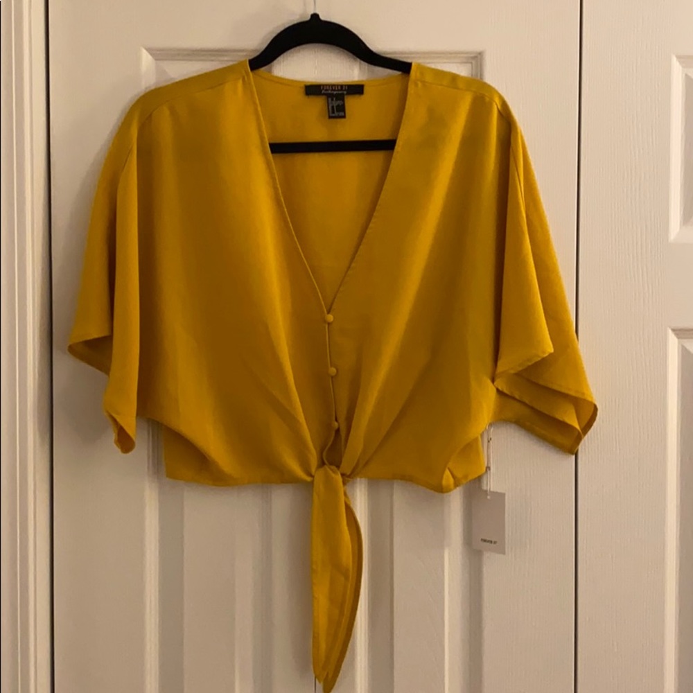 New with tags. Yellow tie blouse